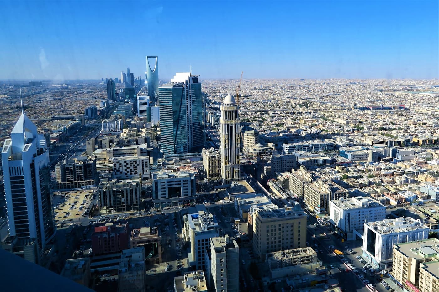 Aerial view of the Riyadh skyline with Kingdom Centre in the distance