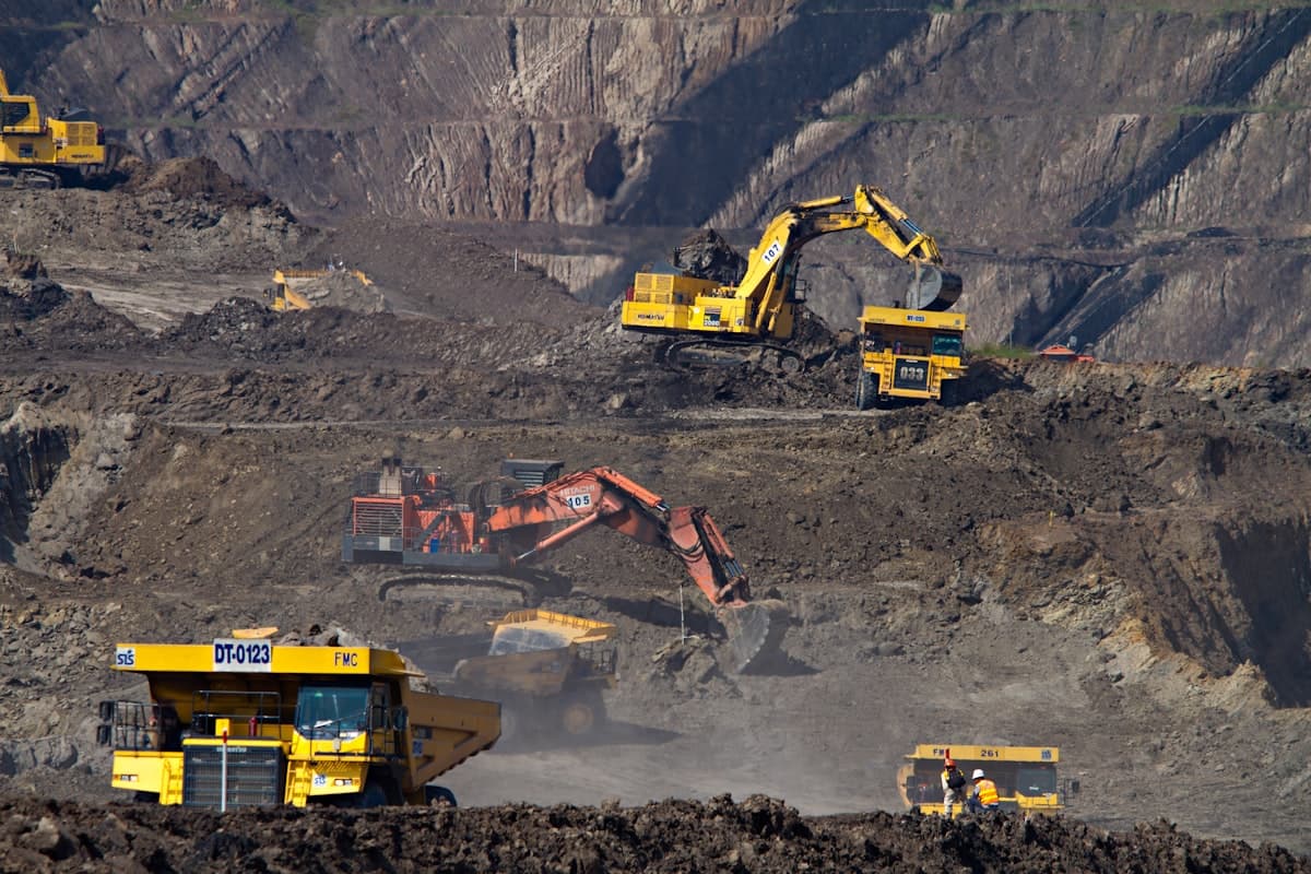 Excavators and haul trucks working across a large site